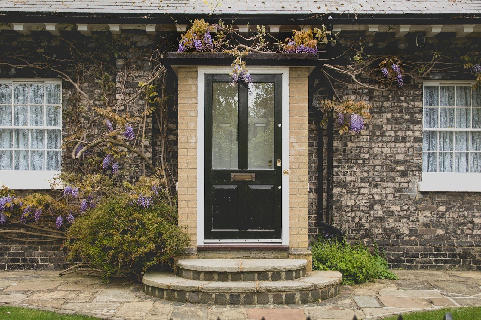 What are the best window options for a period property?. Black and white door during daytime